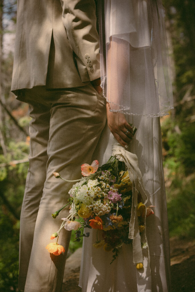 bride and groom bouquet and veil detail shot