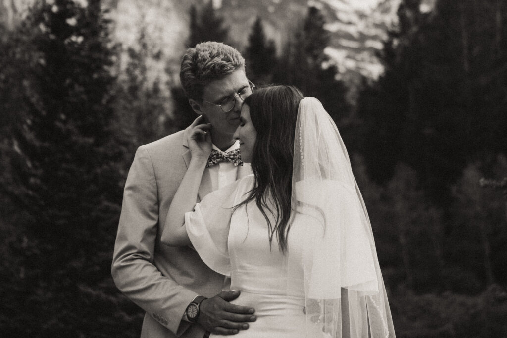 black and white couples photo with mountain background