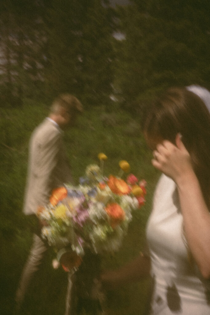 bride and groom walking in the mountains