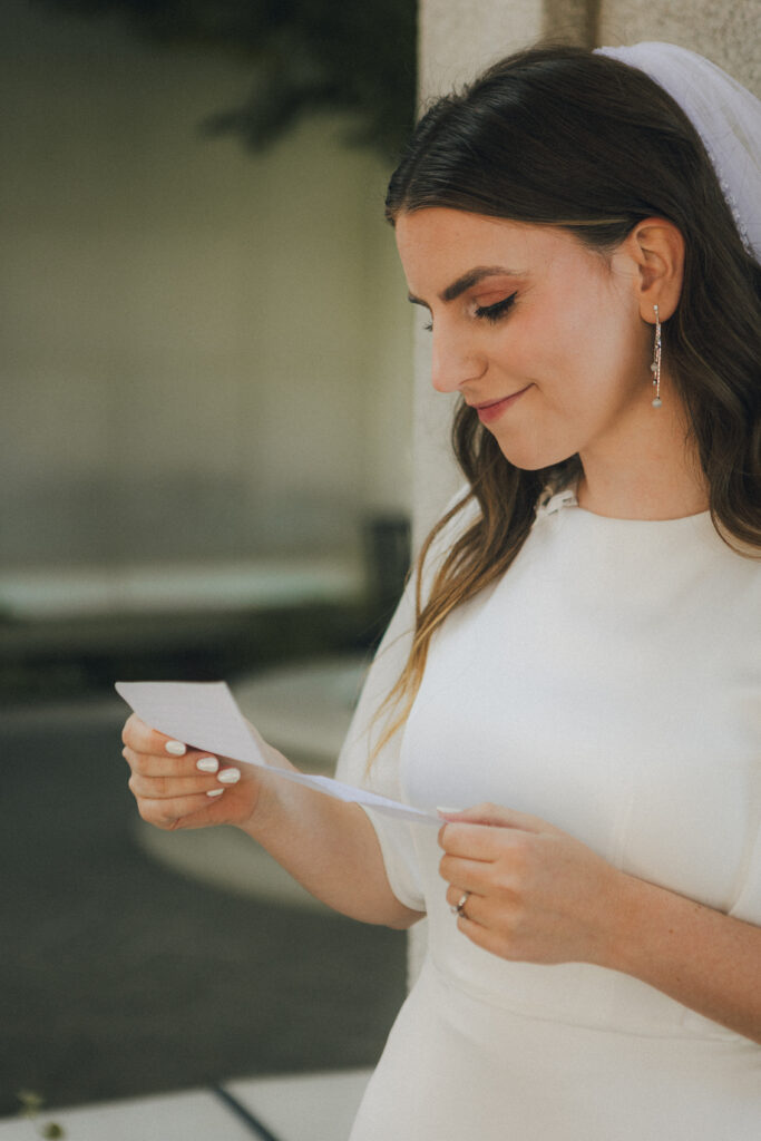 bride reading love letter from the groom