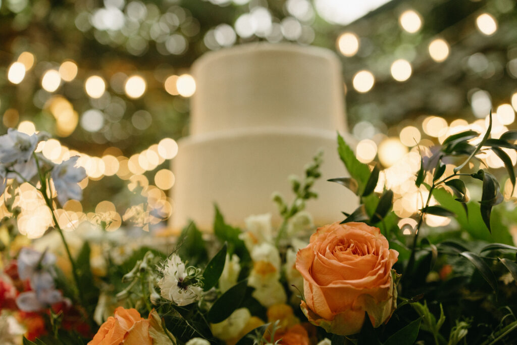 close up shot of the florals surrounding the wedding cake