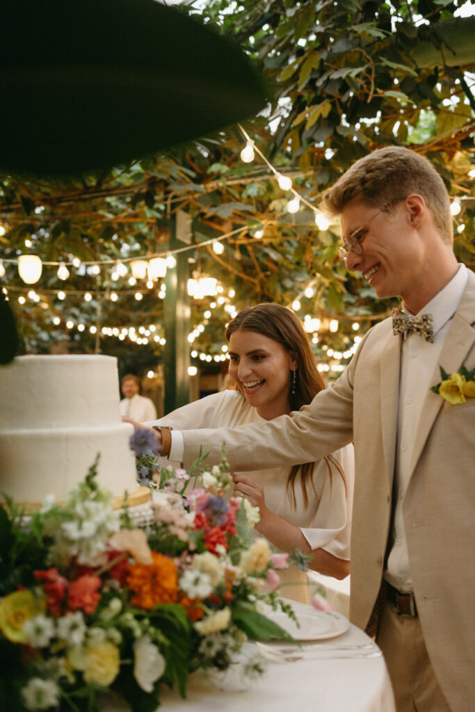 bride and groom cut the cake