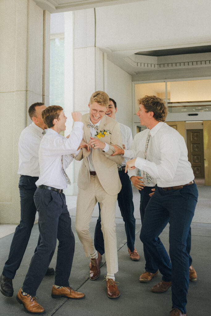 groomsmen hyping up the groom