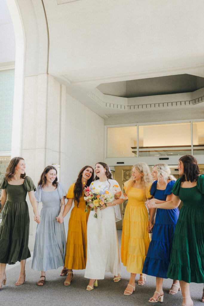 bridesmaids walking by the bride
