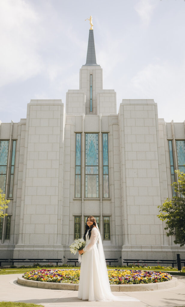 bride in front of temple after wedding ceremoy