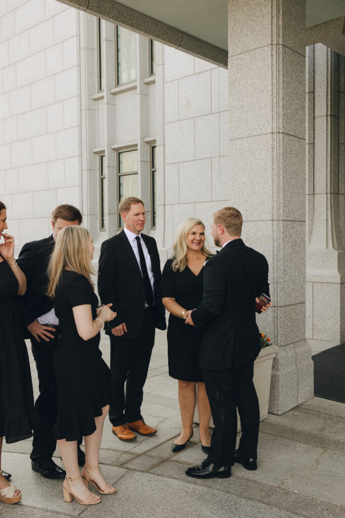 bride and groom greet family