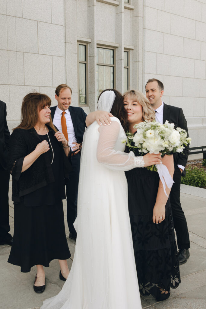 bride and groom greet family