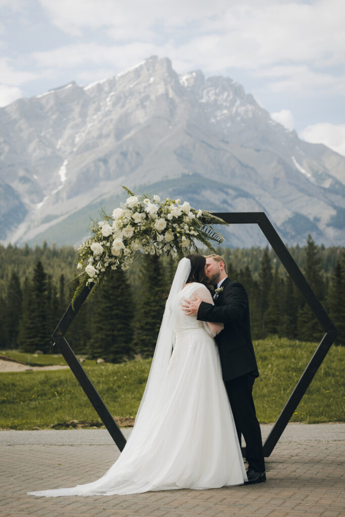 first kiss as a married couple at the altar mountain wedding