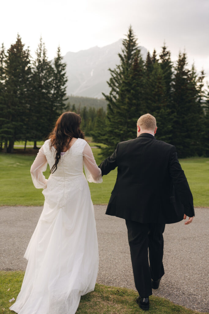 bride and groom exit the wedding venue