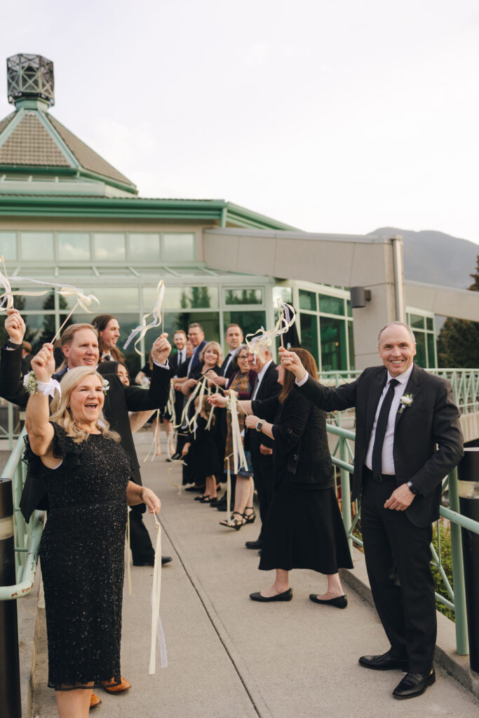 guests waving goodbye after the wedding