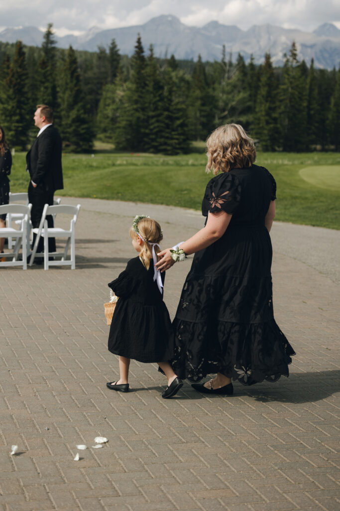 flower girl walking down the aisle