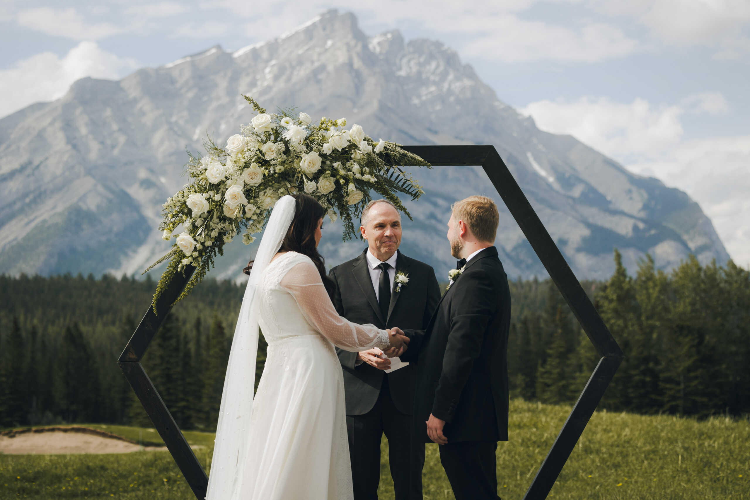 bride and groom at the altar during mountain wedding ceremony